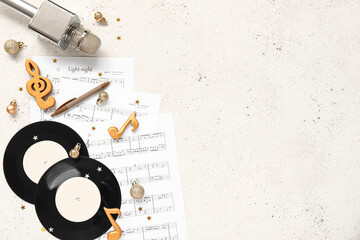 Poster - Composition with vinyl disks, music sheets and Christmas decorations on light background