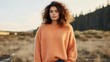 Minimalistic view of a cozy Peach Fuzz sweater, made from repurposed cashmere and wool. The oversized fit and chunky knit create the ultimate in comfort and style.