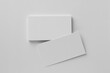 © New Africa - Blank business cards on white background, top view. Mockup for design