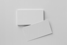 Blank Business Cards On White Background, Top View. Mockup For Design