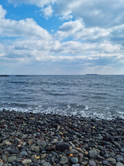 Canvas Print - It is a beach with round pebbles.