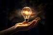 A hand reaching for a lightbulb, indicating the emergence of an investment idea, Black Background