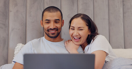 Canvas Print - Laptop, happy and young couple in bed watching movie, film or show together at home. Smile, technology and man and woman relaxing in bedroom streaming a video on computer for bonding at modern house.