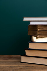 Wall Mural - Stack books in front of the blackboard