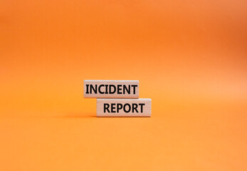 Incident Report symbol. Concept word Incident Report on wooden blocks. Beautiful orange background. Business and Incident Report concept. Copy space
