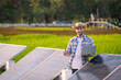 © kamonrat - Male farmer checks the readiness of solar cells for agriculture.