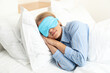 © Atlas - A young woman sleeps in a sleep mask