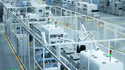 Leinwandbilder - Modern Manufacturing Plant with Advanced Robotic Arms Operating an Assembly Line with Electronic Components Moving on a Conveyor Belt. Timelapse Footage From an Elevated Top Angle.