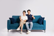 © Q88 - Image of an Asian couple posing on a white background