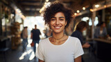 Fototapeta  - Portrait of beautiful young Arabian woman with curly hair smiling in cafe.