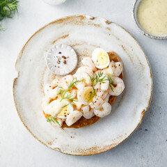 Wall Mural - Traditional Scandinavian shrimp sandwich with egg and dill