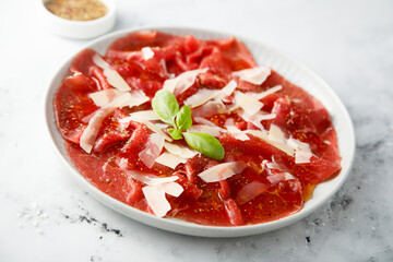 Wall Mural - Traditional beef carpaccio with parmesan cheese