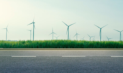 Wall Mural - long roads and wind turbine farms behind. clean and renewable energy. environmentally responsible lo