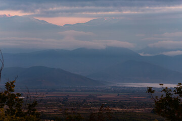 Wall Mural - valley in the mountains at dawn in the fog