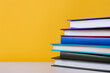 stack of colorful books. textbooks stacked on top of each other, color background. education concept
