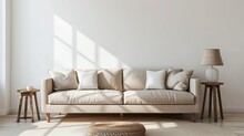 Beige Sofa With White Pillows And Table On The Side With Lamp, White Wall, Minimalist Interior Design Living Room