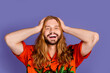 © deagreez - Portrait of impressed man with beard ginger hairstyle wear stylish shirt hold arms on head open mouth isolated on purple color background