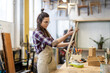 © pikselstock - Female carpenter working in her workshop