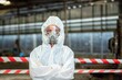 © BESTIMAGE - Male inspector team investigate danger chemical gas leak spill with safety face mask PPE suit in area closed barricade security tape. danger dirty area infected chemical leak spill cross stripe ribbon