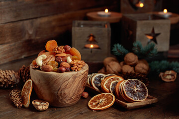 Poster - Dried fruits and assorted nuts on an old wooden table.