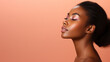 Young African American Woman with Perfect healthy smooth Skin touches her neck with her hand and looks at the camera. Isolated. Fashion Portrait of a beautiful black woman in profile, light makeup