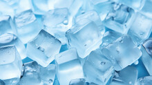 Top View Of A Pile Of Frosty Frozen Ice Cubes On A Blue Background, Refreshing, Cold, Ready For Adding To A Cold Drink In A Celebration Or Party Or Adding To A Frozen Fruit Smoothie Or Blended Dessert