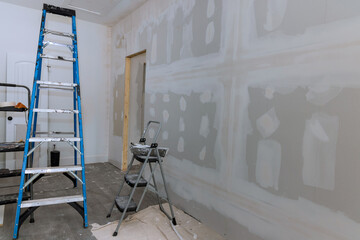 Canvas Print - Plastering drywall is complete ready for painting in new house that is under construction