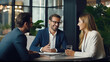 © Doraway - Photo of smiling and chatting with colleagues in an office