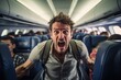 Aggressive adult male passenger with emotion on his face screaming while standing on plane, panicking