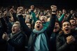 © ORG - A photograph of a cheering crowd in a football stadium.