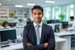 © Neha - young indian businessman standing at office