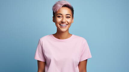 Sticker - Happy girl wearing a pink t-shirt, smiling against a blue background