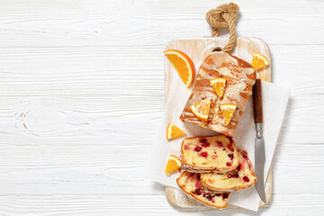 Wall Mural - orange cranberry loaf with orange glaze, top view