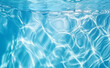 Clear water in swimming pool with ripple in clean aqua liquid. Summer wallpaper blue background and reflection