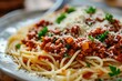 From Italy with Love: Dive into the Authentic Taste of Spaghetti Bolognese - Long, Perfectly Cooked Pasta Dressed in a Luscious Meat Sauce Brimming with Ground Beef, Tomatoes, and Fragrant Herbs