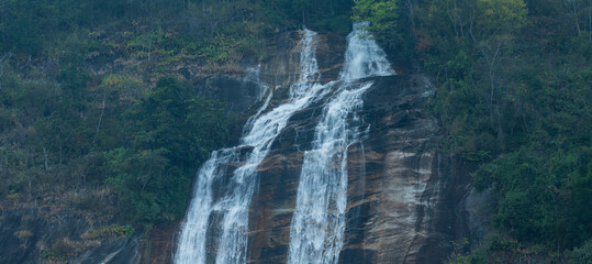 Wall Mural - Close up waterfall in the forest.