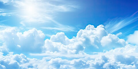 Wall Mural - beauty of summer sky with scattering of fluffy white clouds against backdrop of bright blue. scene e