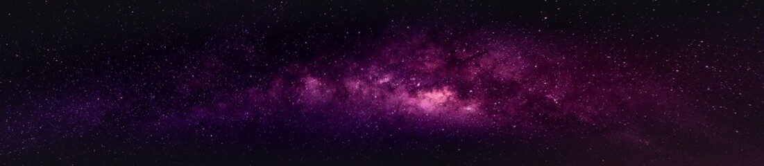 milky way in the night sky and stars on dark background with noise and grain. photo taken with long 
