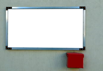 Blank for text or photo poster - an advertising and information board with a white background and a mailbox on the wall of the building