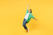 © ViDi Studio - Full body elderly blonde woman 50s year old wear green shirt glasses casual clothes lean back stand on toes with outstretched hands dance isolated on plain yellow background studio. Lifestyle concept
