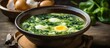 Scrumptious spinach and egg soup, plated on the table.