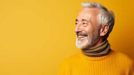 Wall Mural - Elegant smiling elderly blond Caucasian with gray hair with perfect skin, on yellow background, banner.