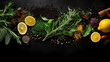 Closeup of healthy food, fresh lemon slices, herbs and spices isolated on black background