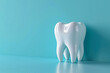 three-dimensional rendered single tooth on blue background, dental health concept
