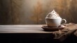  a cup filled with whipped cream sitting on top of a saucer on top of a wooden table next to a brown blanket.