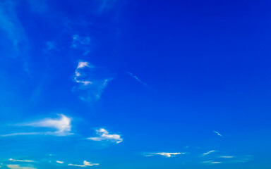 Wall Mural - Blue sky with chemical chemtrails cumulus clouds scalar waves sky.