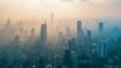 An aerial view of a big city skyline with smog and pollution visibly engulfing the buildings and streets. The image aims to convey air pollution's prevalence and risks.