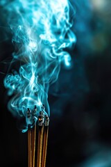 Wall Mural - A close-up view of an incense stick with smoke billowing out of it.