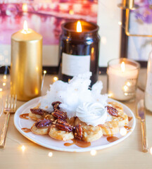 Wall Mural - Belgian waffles with maple syrup and pecan on a wooden table, breakfast, no people, close up