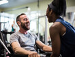 Inclusive Fitness: Personal Trainer Assisting Client with Physical Disability